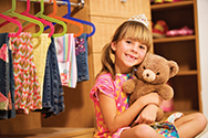 girl with teddy bear and closet